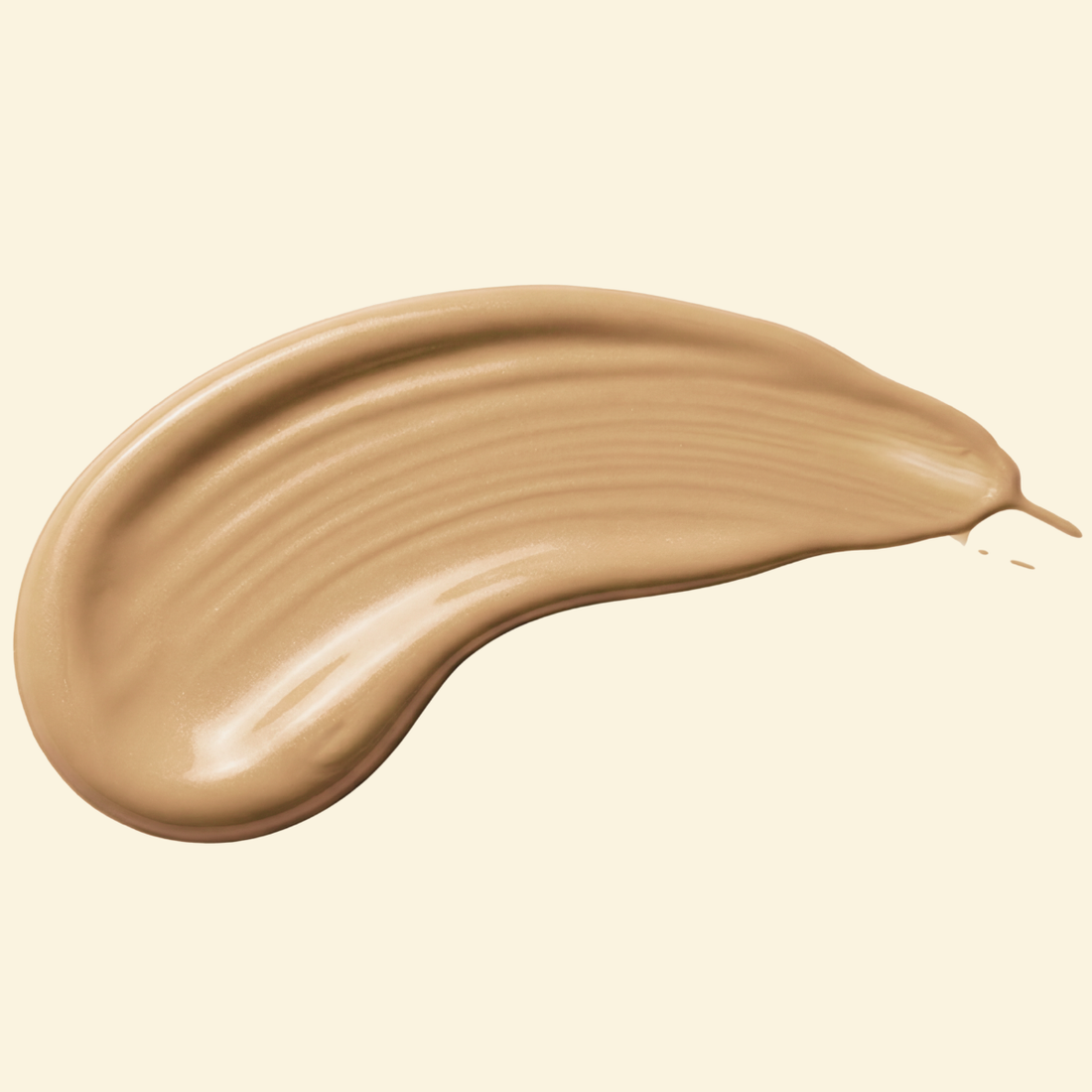 A single swipe of tinted mineral sunscreen on a cream background, showing its smooth gel texture